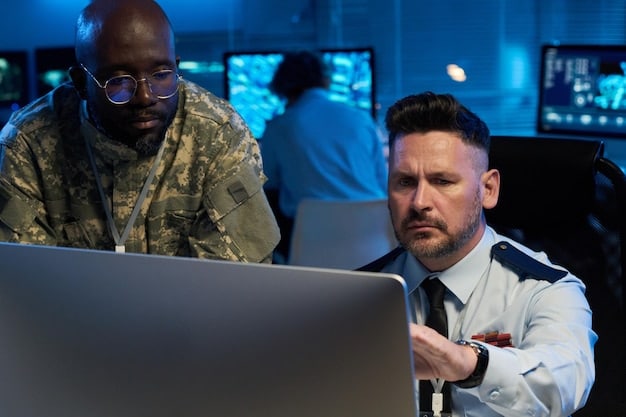 Employees participating in a cybersecurity training session, viewing a presentation on phishing attacks and learning to identify suspicious emails.