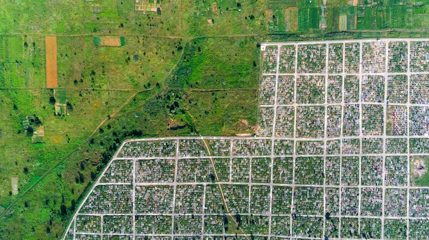 An aerial view of a large solar farm, showcasing rows of solar panels converting sunlight into electricity. The image should emphasize the scale and efficiency of solar energy production.