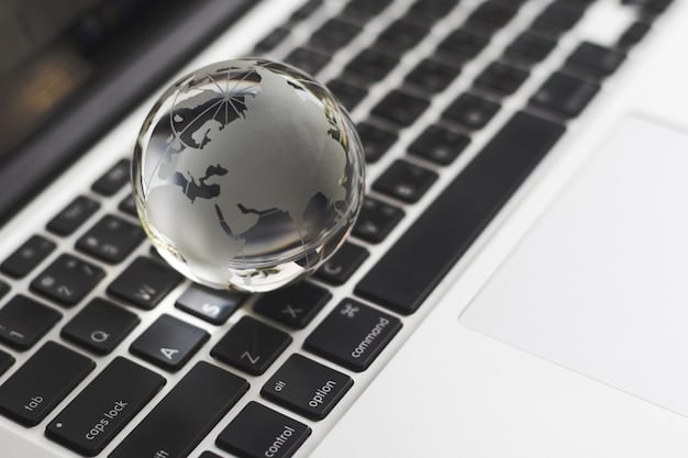 A detailed close-up of hands typing on a laptop, surrounded by legal documents and a globe, symbolizing the digital aspects and legal framework of international trade agreements.