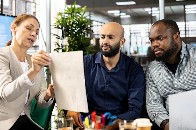 A diverse group of professionals collaborating in an office setting, symbolizing effective workforce planning and hiring strategies.