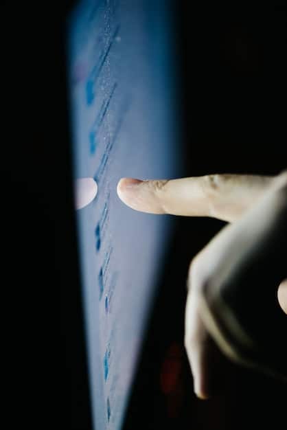 A close-up shot of a hand interacting with a holographic display showing various skill sets and their demand in the current labor market. The background is blurred, suggesting a futuristic workplace environment.