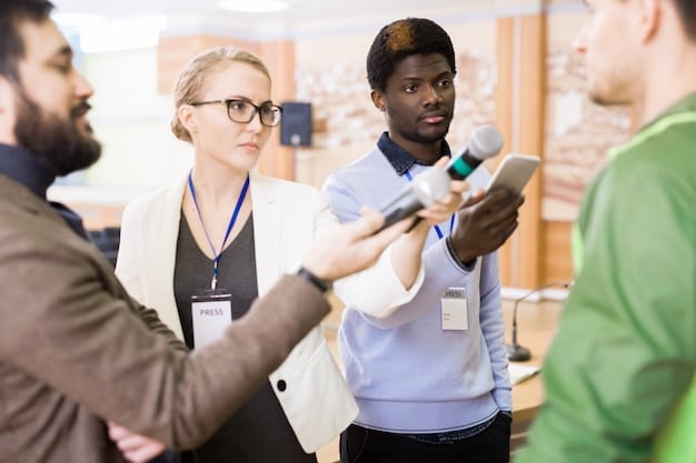 A person at a conference booth, actively engaging in a conversation with another attendee, surrounded by promotional materials and displaying a friendly and professional demeanor.