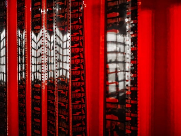 Close-up of a data center cooling system featuring advanced liquid cooling technology. The focus is on the intricate network of pipes and cooling plates, showcasing the efficiency and innovation of the system. The background includes server racks blurred, emphasizing the data center environment.