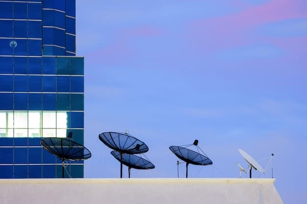 Solar panels on the roof of a large data center, with a clear sky and distant wind turbines, symbolizing integrated renewable energy solutions for critical infrastructure.