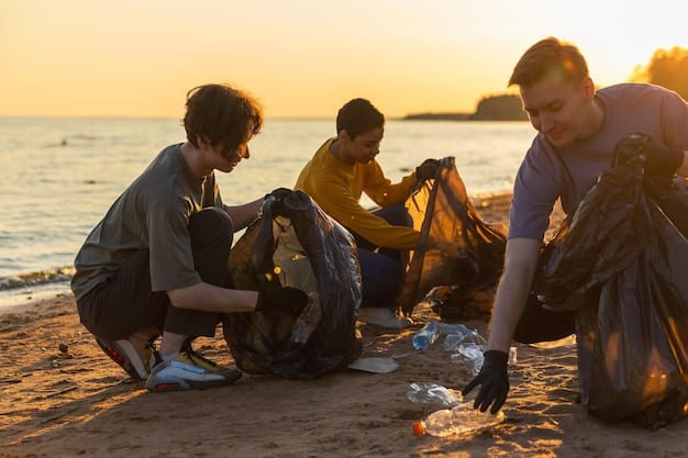 Volunteers participating in a beach cleanup, collecting plastic debris in large bags. The volunteers are wearing gloves and using trash pickers. The beach is sandy, and the ocean is visible in the background. The overall image conveys a sense of community action and environmental stewardship.