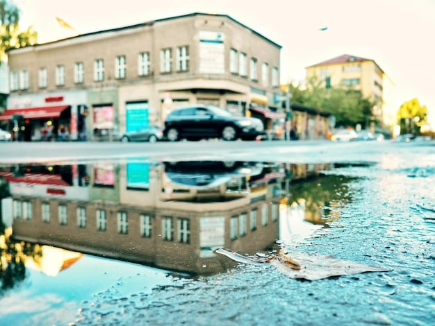 A flooded street with submerged cars, symbolizing the impact of extreme weather events and rising sea levels.