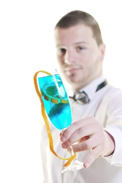 A scientist in a lab coat precisely pipetting liquid near DNA models, illustrating the detailed and controlled nature of genetic engineering.